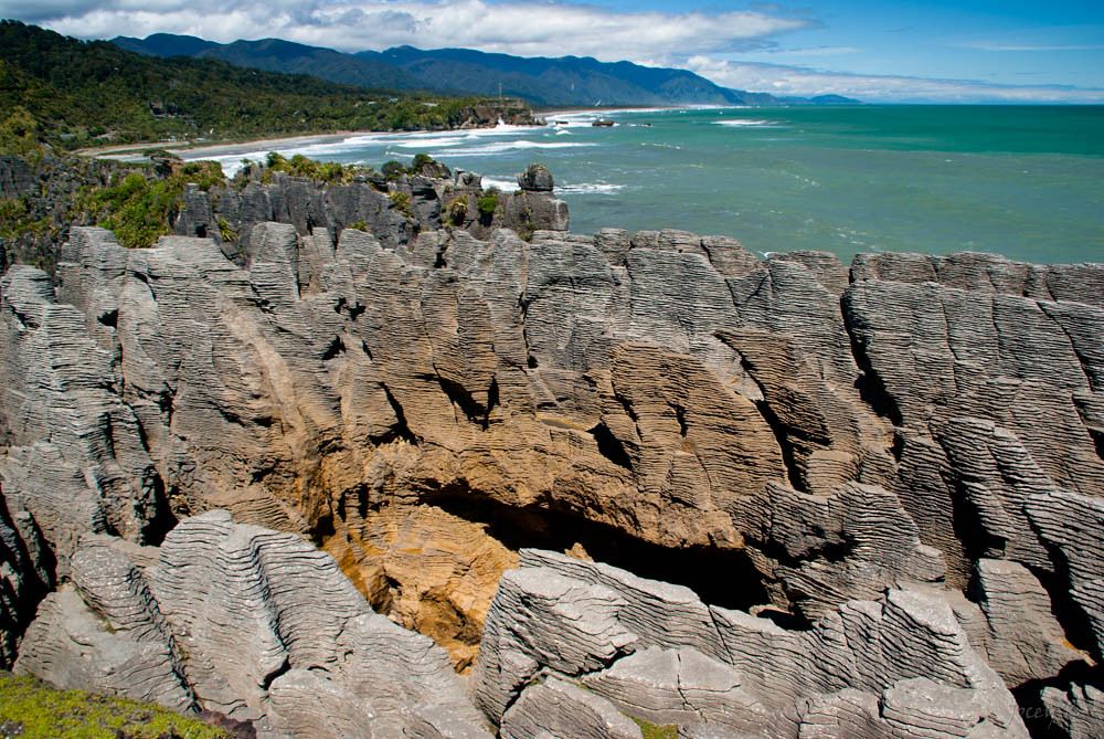 The layered pancake rocks with the ocean in the background
